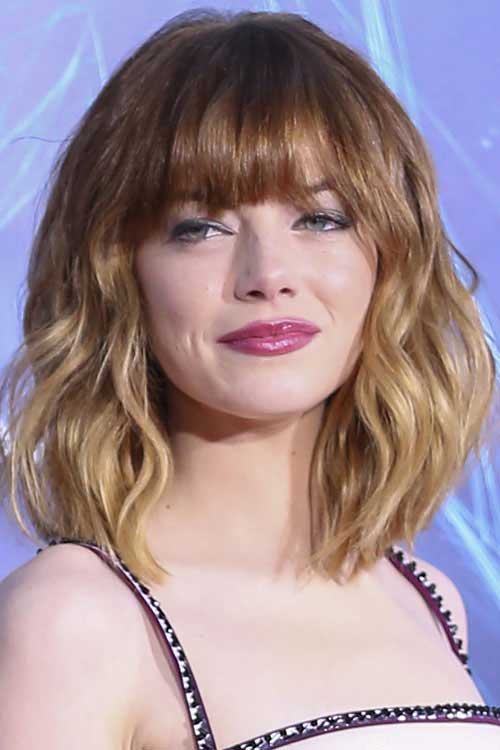 Emma Stone’s Wavy Hair with Bangs