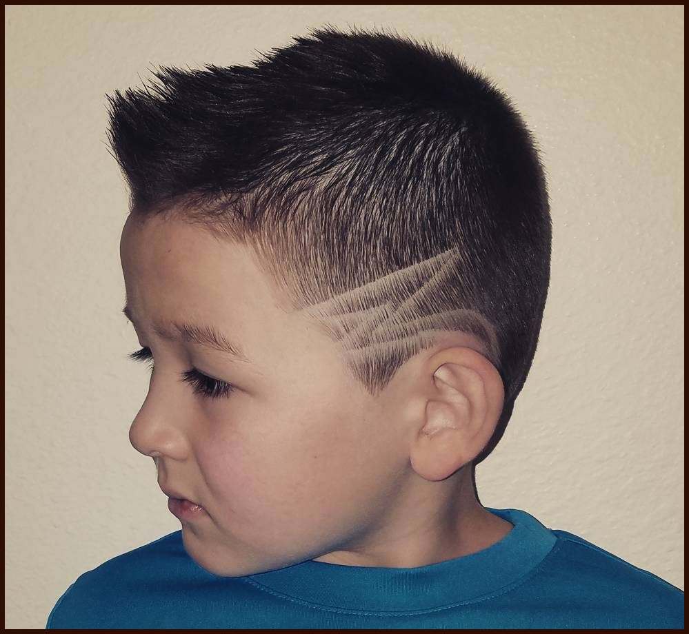 Center Spike with a Designer Low Fade Haircut