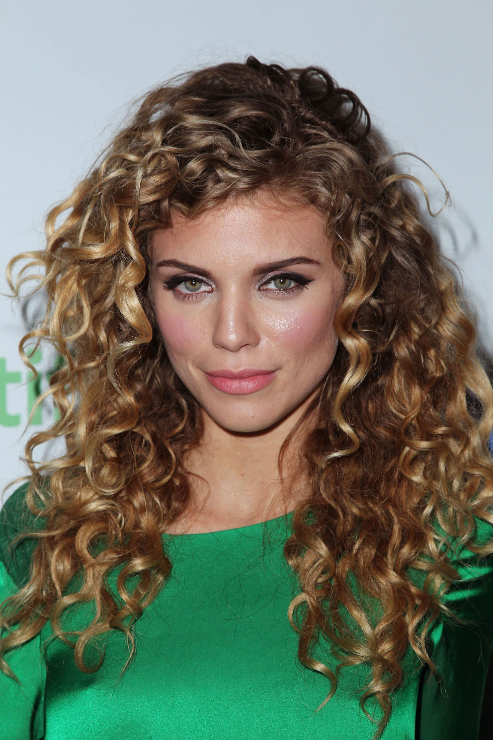 Get this curly middle sized hairstyle