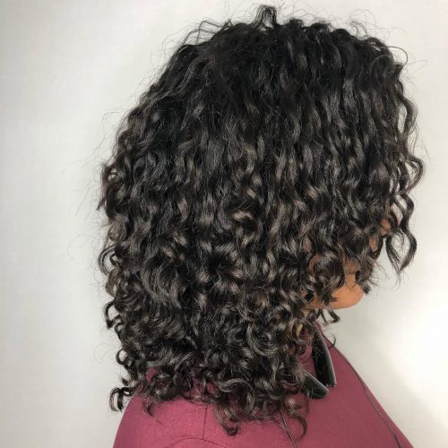 Dark espresso with very curly hair