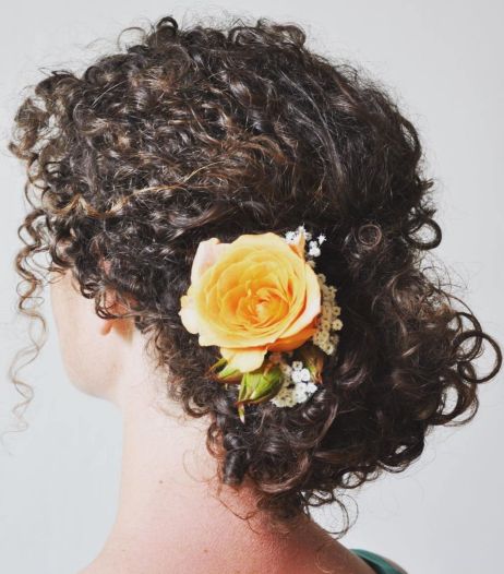 Spiral Curl Updo with Flower Adornment