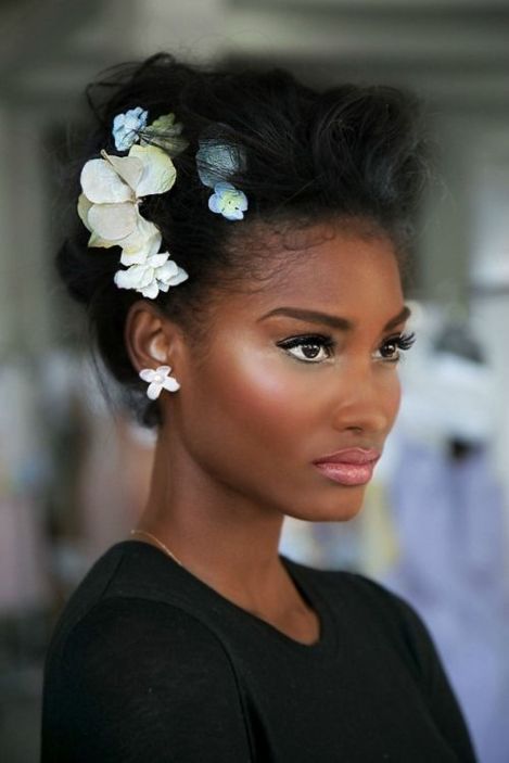 Black Wispy Updo With A Cluster Of Flowers
