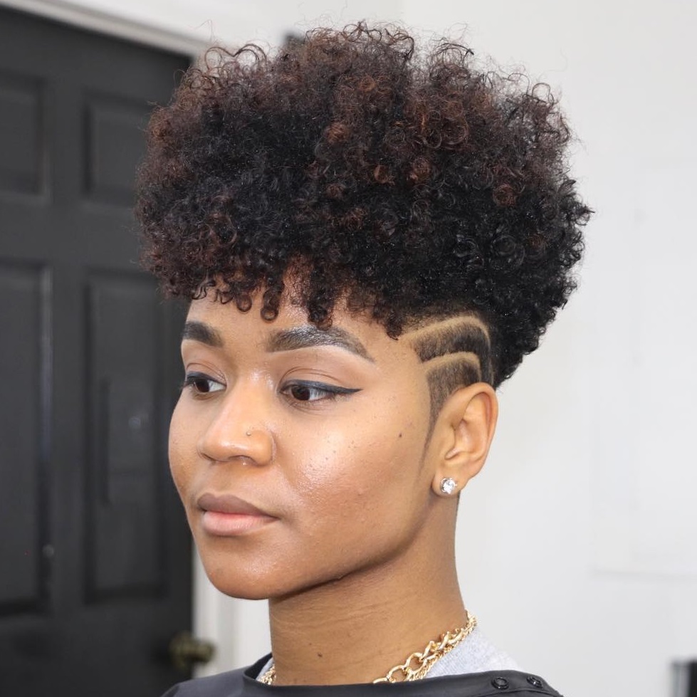 tapered cut with a high top and dense spiral bangs