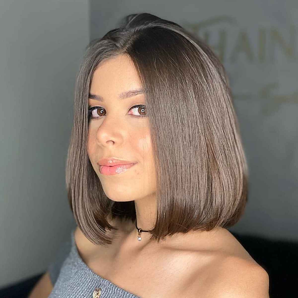 classic long bob for round faced women with straight hair 1